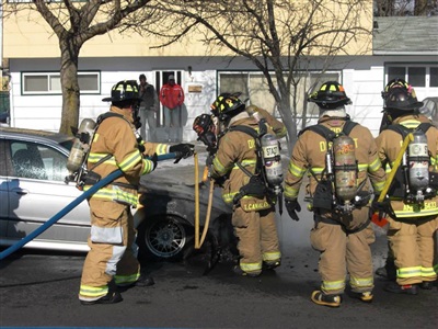 Brian putting out a car fire