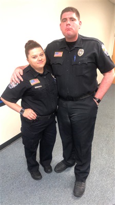 Brian in uniform with a woman
